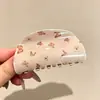 Pinza para el cabello de tamaño mediano de lunares blancos y negros estilo francés, diseñada para la parte trasera de la cabeza, un accesorio para el cabello nuevo y elegante con un aspecto sofisticado y con estilo
