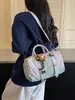 Bolso tipo Boston casual ligero de dos tonos 2026 nuevo versátil moda de invierno bandolera y de hombro