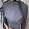Camiseta interior básica de manga larga y cuello medio para mujer, nueva colección de principios de otoño 2026, corte ajustado, adelgazante, blanca, simple, versátil