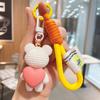 Llavero creativo de resina con forma de oso y corazón, bonito y exquisito colgante para bolso de pareja, pequeño regalo al por mayor