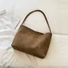 Bolsa de mão estilo retrô da Shuai Mi, uma nova coleção de outono de 2026 apresentando uma bolsa de ombro pequena, minimalista e chique, projetada para o trajeto diário.