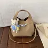 Bolso tipo cubo minimalista de alta gama para mujer, nuevo modelo de moda 2025, versátil, de nicho, para llevar al hombro o cruzado, elegante bolso de mano para commuting