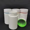 Garrafas plásticas sólidas brancas feitas sob medida para produtos de saúde com gráficos impressos e tampas multicoloridas, garrafas seladas para embalagem de cápsulas probióticas