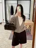 Han Xun Coleção de Outono Quente, Macio e Aconchegante Lã Pura Modelagem Solta Suéter de Tricô Falso Duas Peças para Mulheres 2026 Novo Modelo 27501