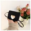 Mochila de un solo hombro para niña estilo coreano, Bolso cruzado ligero y versátil con forma de corazón, Bolso infantil de moda, nuevo y moderno
