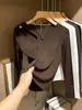Camiseta Base Hueca de Manga Larga para Mujer Primavera/Otoño 2026, Cuello Redondo Negro, Corte Ajustado, Elegante Camiseta Superior de Estilo Americano Única