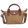 Bolso tote nuevo de gran capacidad para mujer 2026, bolso de hombro de nailon para ir al trabajo, moderno, simple, versátil y con un toque de alta gama