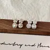 Novedoso Estilo Aretes Apilados con Diamantes Acabado Perla de Luz de Luna de Cristal Aretes de Flor de Perla Apilados con Diamantes Súper Brillantes