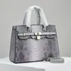 2023 nuevo patrón de serpiente de alta calidad gran capacidad transfronteriza hombro bandolera de alta gama estilo occidental todo partido bolso de mujer bolso grande