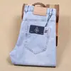 Pantalones de algodón elástico finos para hombre de primavera y verano, rectos, de cintura media, azul claro, fibra de poliéster, jeans blancos de moda para hombre
