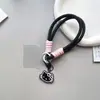 Niña Negro Rosa Estéreo Gato Kt Colgante Giratorio para Teléfono Móvil Cuerda para la Muñeca Mochila de Dibujos Animados Colgante de Cámara CCD Cordón para Mujeres