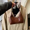 Bolsa de Bolinho Transfronteiriça Tendência Nicho para Mulheres 2026 Nova Moda Versátil Bolsa Transversal para Sair e Trabalhar Pequena Bolsa de Mão