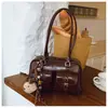 Popular bolso de bolos retro artístico transfronterizo para mujer, nuevo modelo 2026, bolso de mano y bolso de hombro versátil para el trabajo, bolso de axila para mujer