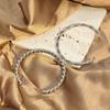 Pulsera abierta de acero inoxidable Mobius estilo europeo y americano línea de amantes pulsera retorcida personalidad Joker mayoreo