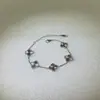 Pulseira de Trevo de Quatro Folhas a Laser Versão Alta Dourada Popular Transfronteiriça Lote de Ouro 18K Flor de Aço Titânio Pulseira Joia Não Desbota