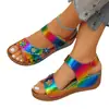 Sandalias de cuña para mujer talla grande 2026 Nuevo estilo europeo y americano caladas florales suela gruesa de una tira color liso sandalias romanas para exportación