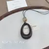 Nuevo Collar Largo Hueco Estilo Chino Forma de Gota de Agua para Mujer, Cadena de Suéter Retro de Lujo Ligero de Gama Alta, Accesorios Simples y Versátiles