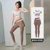 Calça Esportiva de Corrida, Fitness e Yoga Feminina de Cintura Alta Elástica Cruzada Pêssego Levanta Bumbum e Aperta Barriga Secagem Rápida
