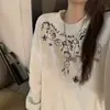Sudadera de manga larga estilo retro americano para mujer, nuevo diseño de principios de otoño 2026, única y holgada, con un ambiente relajado y casual
