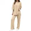Conjunto feminino europeu e americano transfronteiriço de mangas médias e corte solto: conjunto de duas peças com top de gola redonda ombro a ombro e calça pantalona com fenda lateral