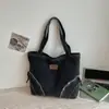 Bolso de mezclilla de gran capacidad, nuevo bolso de mano casual para el verano 2026, bolso tote de estilo relajado para mujer