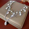 Collar de perlas con forma de mariposa estilo retro francés, elegante y moderno, con cadena de clavícula, versátil y de alta gama.