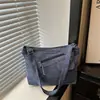 Nuevo bolso de hombro de mezclilla de nicho estilo retro japonés, mochila de lona versátil con bloques de color para estudiantes mujeres
