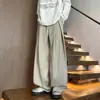 Outono 2026 Calças Casuais de Alta Qualidade com Caimento High Street Estilo Coreano Masculino Cor Sólida Alongadoras de Perna Calça Social de Corte Reto Tendência