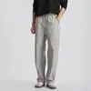 Pantalones casuales rectos y sencillos de moda con cordón para hombre, color liso de otoño, textura ligera, corte holgado, pantalones de pierna ancha versátiles