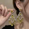 Brincos estilo vintage, inspirados em joias de corte, vazados, em formato de gota, com franjas, de design luxuoso e elegante, com strass brilhantes, para mulheres