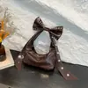 Bolso de Hombro Individual Estilo Dulce y Fresco de Gama Alta para Mujer 2025 Nueva Moda Bolso Personalizado con Remaches Bolso de Celebridad de Internet con Lazo Bajo el Brazo