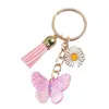 Llavero de Resina con Flor y Mariposa con Borla, Estilo Nuevo Dulce, Transfronterizo, para Mujer, Lindo Colgante para Bolso de Viaje al Aire Libre, Venta al por Mayor