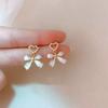 Pendientes de perlas estilo coreano, pendientes de alta gama, temperamento personalizado, estilo Hong Kong, pendientes retro, lujo ligero, estilo Hong Kong, textura atmosférica.