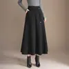 Saia de tricô patchwork casual da moda para mulheres, nova saia de cintura alta em linha A emagrecedora para outono e inverno de 2026, saia elegante com barra larga