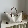Bolsa Casual Estilo Coreano 2026 Otoño Versión Coreana Estampado de Leopardo Retro Gran Capacidad Tote Moda para el Trabajo y el Viaje Bolso de Hombro Único