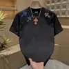 Marca de moda Diseño cruzado Pulóver que realza el blanco Manga corta Unisex Resistente Atuendo de pareja Camiseta de verano holgada Cuello redondo Estilo fresco