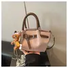Bolso de Mano Retro de Nicho Estilo Coreano Bolso Cubo 2026 Nueva Moda Bolso de Hombro Versátil Bolso Cruzado Casual para Viajar Moderno
