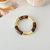 Moda Creativa Popular Europeo y Americano Versátil Elástico Resina Empalme Pulsera de Puño de Tubo Curvo para Mujer Accesorios de Pulsera de Cuentas