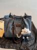 Bolso de mano de gran capacidad para mujer, bolso informal combinable, bolso de mano sencillo de alta gama, 2025