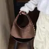 Bolso de mano texturizado de nicho transfronterizo, bolso tote pequeño para mujer, nuevo 2026, bolso simple para el antebrazo, bolso de hombro único versátil para el día a día