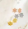 Pendientes de copo de nieve esmerilados de personalidad de moda europea y americana, pendientes de titanio y acero simples de temperamento femenino, populares, no se decoloran, venta al por mayor, versátiles