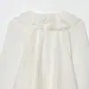 Venta al por mayor transfronteriza Primavera 2026 Nueva moda para mujer Estilo europeo y americano Camisa de manga larga decorativa plisada en capas para mujer en blanco