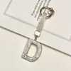 Pingente de chaveiro de carro com 26 letras em inglês cravejado de diamantes transfronteiriço, decoração de bolsa com strass de argila, atacado de chaveiro de celular