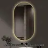 Espejo de baño inteligente con forma ovalada y marco de aluminio, espejo con iluminación LED, espejo de tocador para pared para el baño, disponible para venta transfronteriza y personalizable