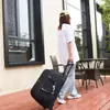 Bolsa de viaje de celebridad de internet estilo coreano bolsa con ruedas bolso de mano para mujer bolsa de equipaje de lona impermeable bolsa suave de almacenamiento para viaje de negocios de corta distancia para hombre