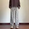 Pantalones casuales de alta gama para hombre, adecuados para el verano, con un diseño fino, holgado, de pierna recta y pierna ancha, con una caída fluida.