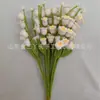 Venta al por mayor de fábrica rama de flor de lirio de cuatro cabezas tejida a mano para decoración de arreglo floral de sala de estar