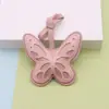 Accesorio colgante de mariposa hueca bicolor, estilo de lujo ligero, accesorio colgante versátil para bolsos y ropa, al por mayor