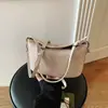 Bolsa de Mano para Empanadas de Color Sólido Súper Caliente Transfronteriza para Mujer Nuevo Estilo 2026 Diseño de Nicho Versátil de Alta Gama Bolso Cruzado para Viajes