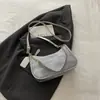 Moda de tendencia transfronteriza bolso de axila mujer 2026 nuevo estilo bolso de hombro único color sólido texturizado bloqueo de color bolso tote pequeño de trabajo mujer